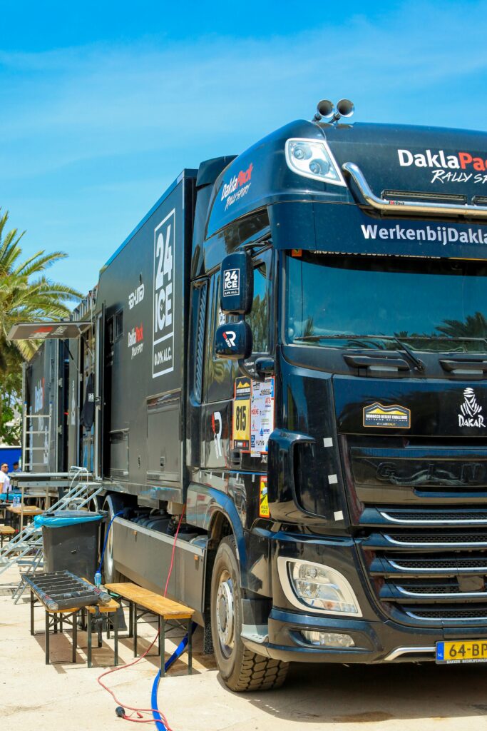 High-performance rally truck parked outdoors, showcasing off-road modifications.